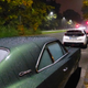 A dew-covered Charger sits under the Nuernberg streetlights.